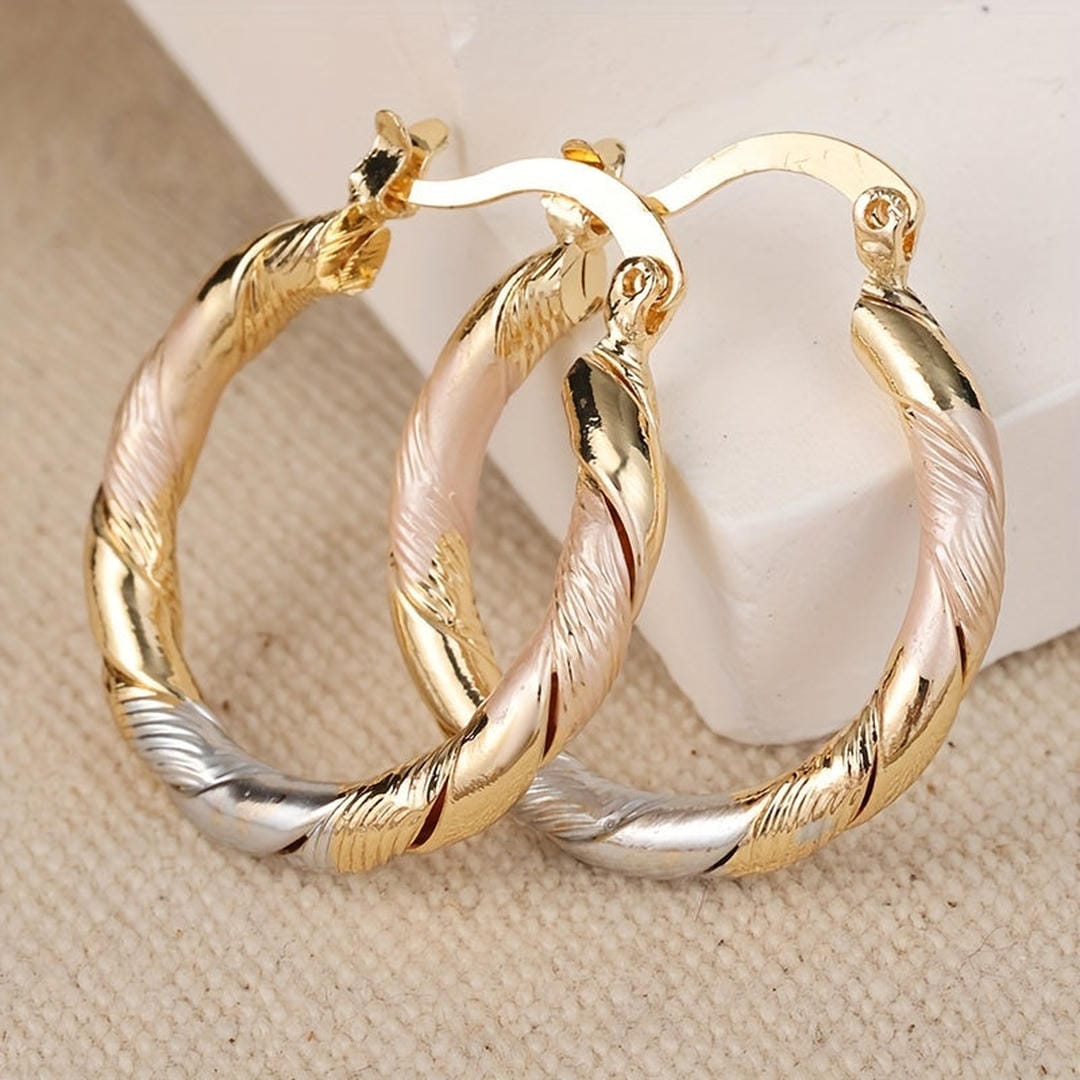 Vintage round earrings in gold, silver, and rose gold