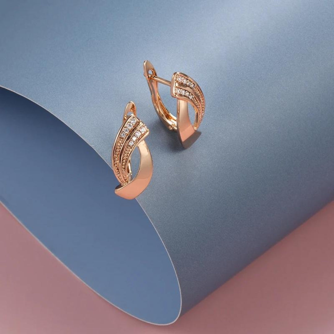 Elegante øreringe i rosaguld og zirconia