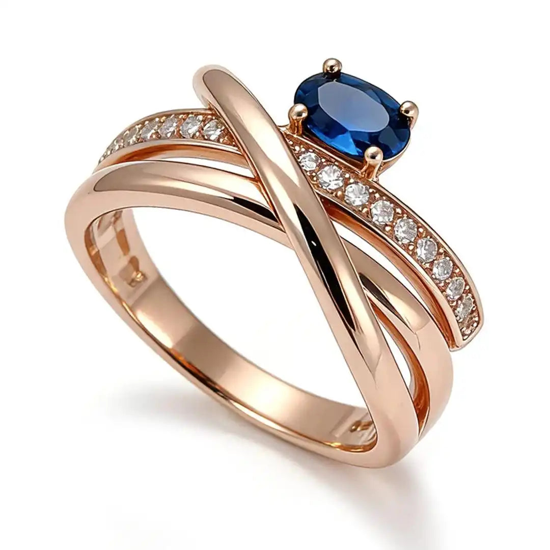 Vintage rose gold-plated cross ring with blue cubic zirconia