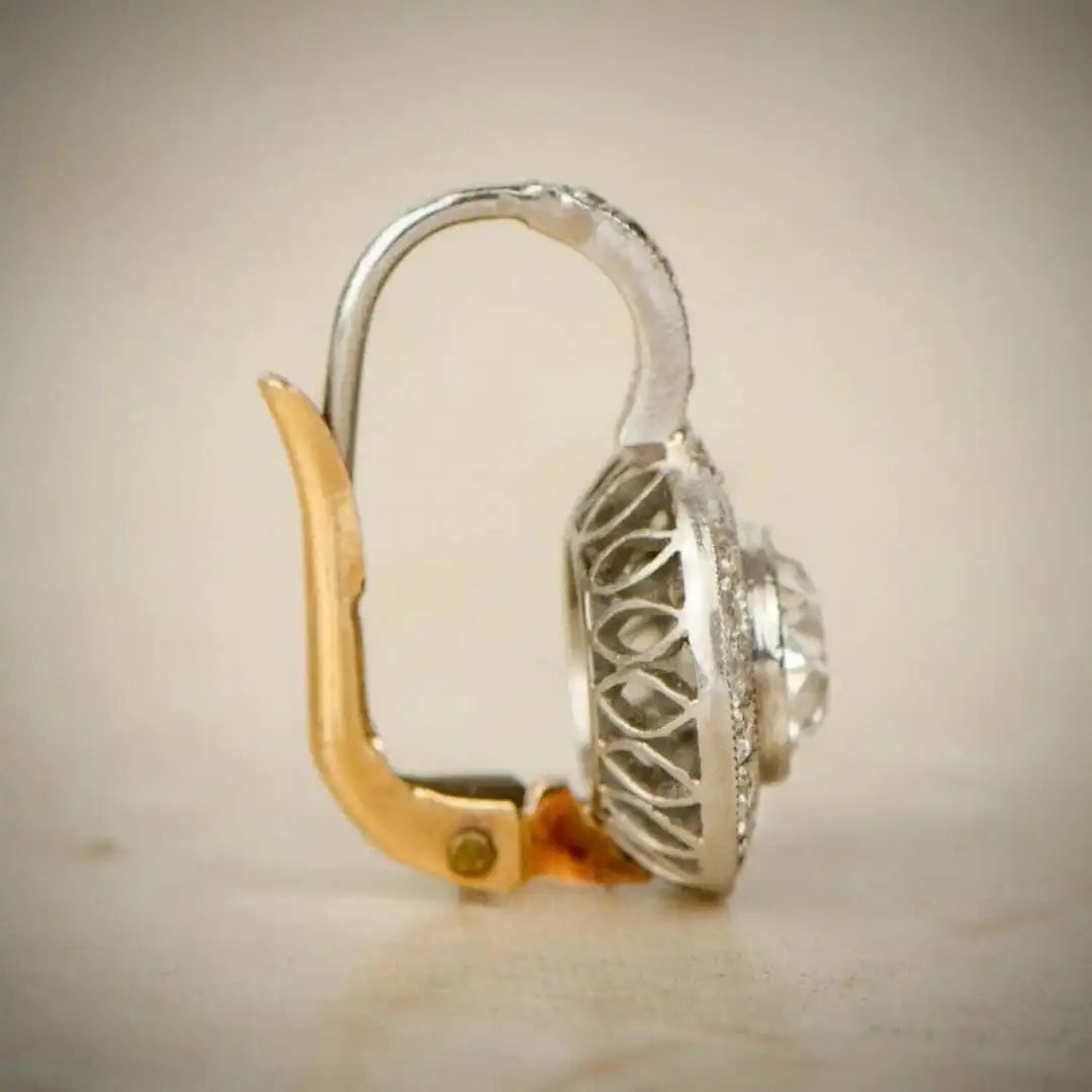 Vintage earrings in gold and silver with crystals