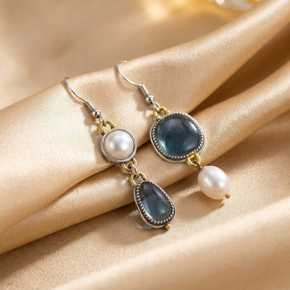 Vintage earrings with blue stones and a pearl