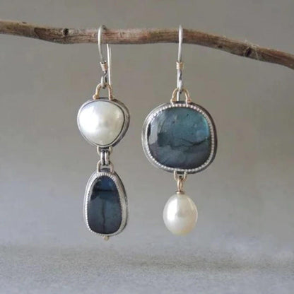 Vintage earrings with blue stones and a pearl