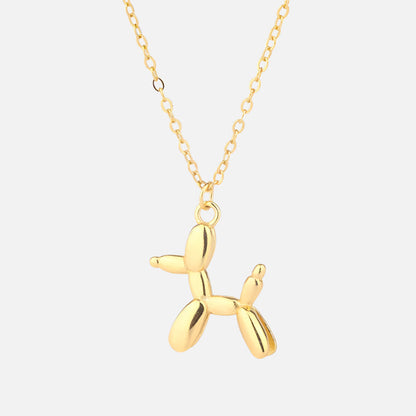 Gold-colored necklace with balloon dog pendant