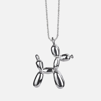 Gold-colored necklace with balloon dog pendant