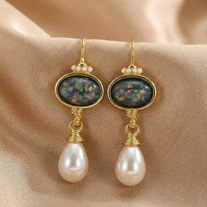 Geometric earrings with black stone and pearl