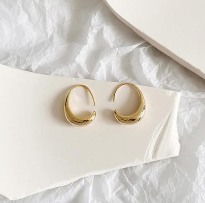 Gold and silver oval hoop earrings