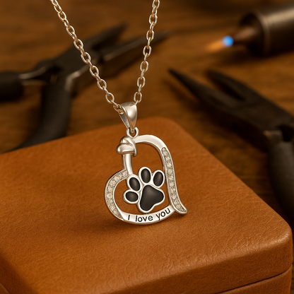 Heart-shaped necklace with dog print and cubic zirconia.