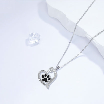 Heart-shaped necklace with dog print and cubic zirconia.
