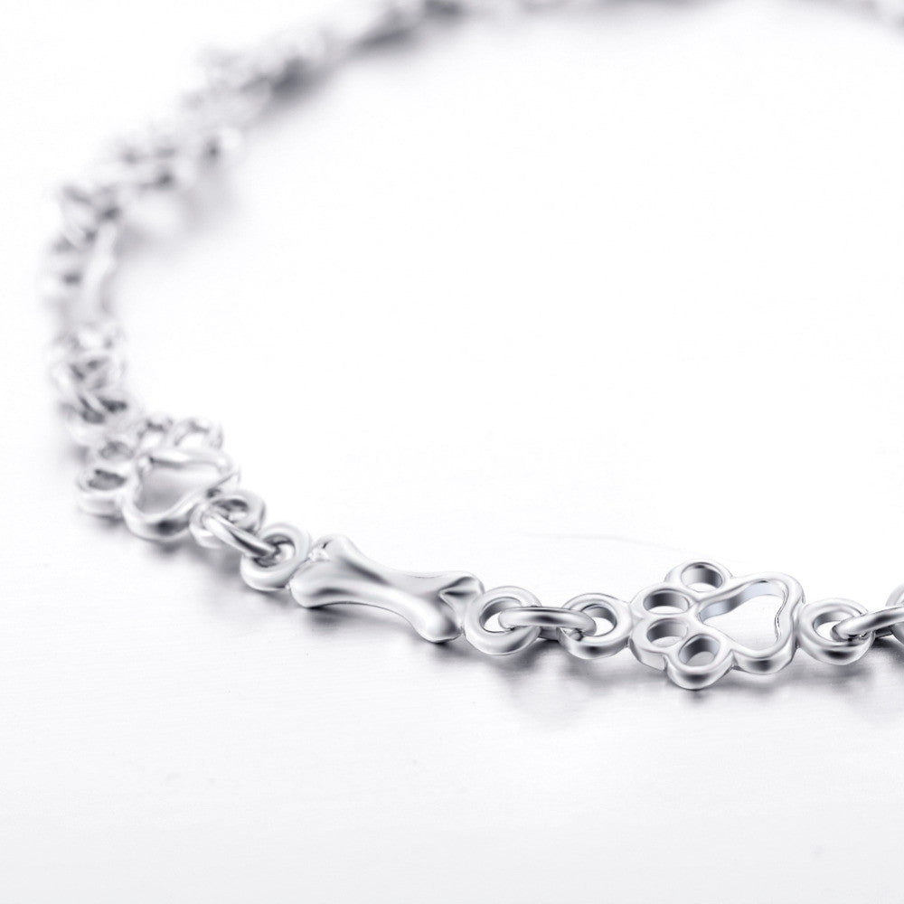 Limited edition pure silver bracelet with dog paws and bones