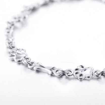 Limited edition pure silver bracelet with dog paws and bones