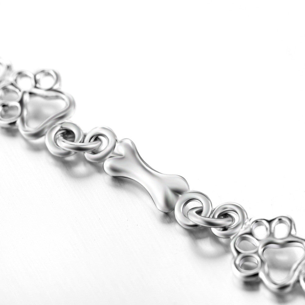 Limited edition pure silver bracelet with dog paws and bones