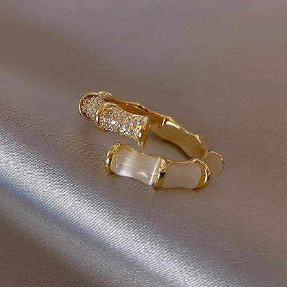 Luxury adjustable ring with white opal in gold