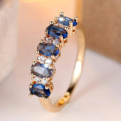 Oval ring med skiftende sten