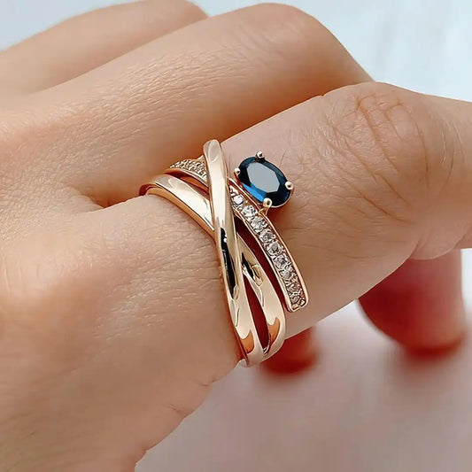 Vintage rose gold-plated cross ring with blue cubic zirconia