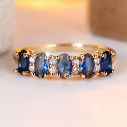 Oval ring med skiftende sten