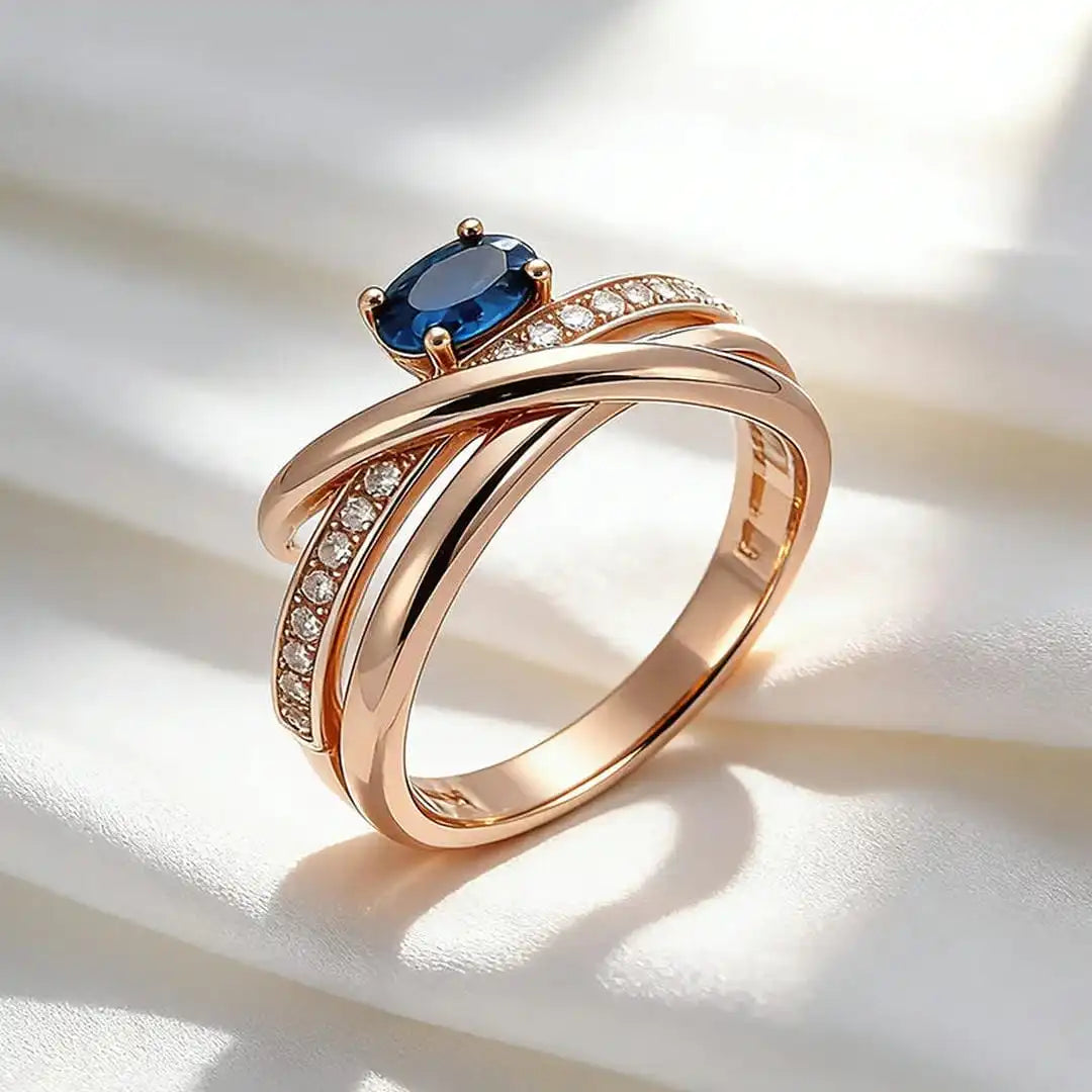 Vintage rose gold-plated cross ring with blue cubic zirconia