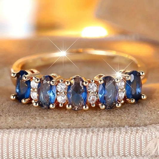 Oval ring med skiftende sten