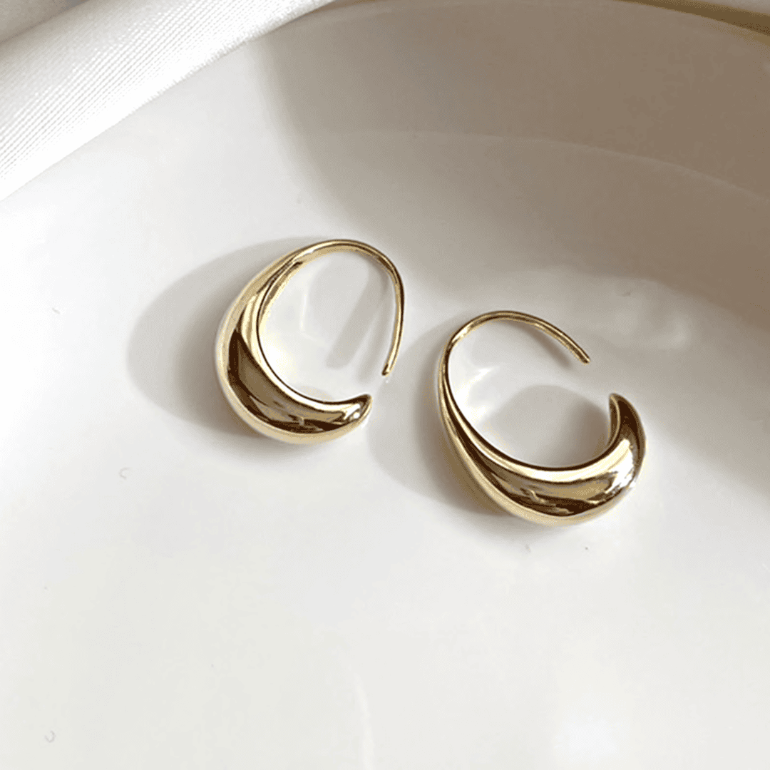 Gold and silver oval hoop earrings
