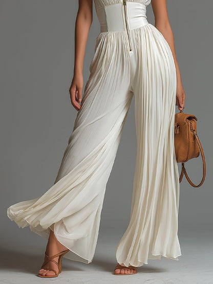 ZSÓFIA JUMPSUIT – PLISSERET CHIFFON MED BLOMSTER
