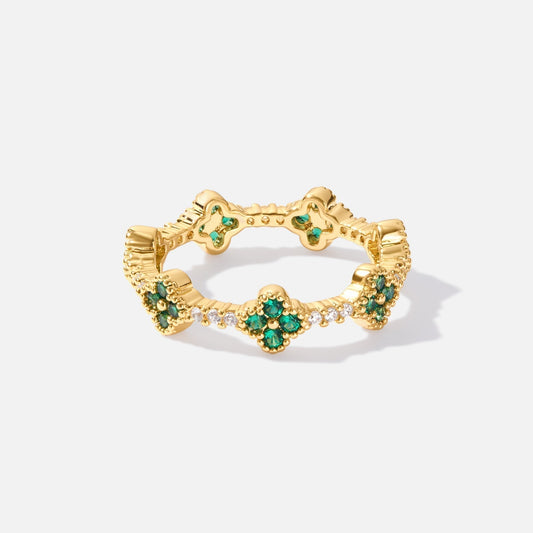 Annika – Gold ring with floral details and Emerald element.