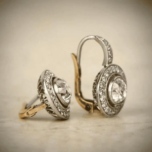 Vintage earrings in gold and silver with crystals