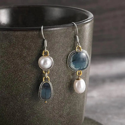 Vintage earrings with blue stones and a pearl