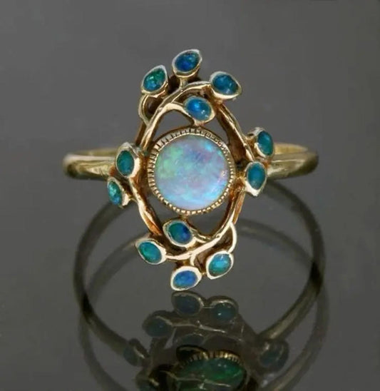 Blå ring med vintagekrystaller og opal